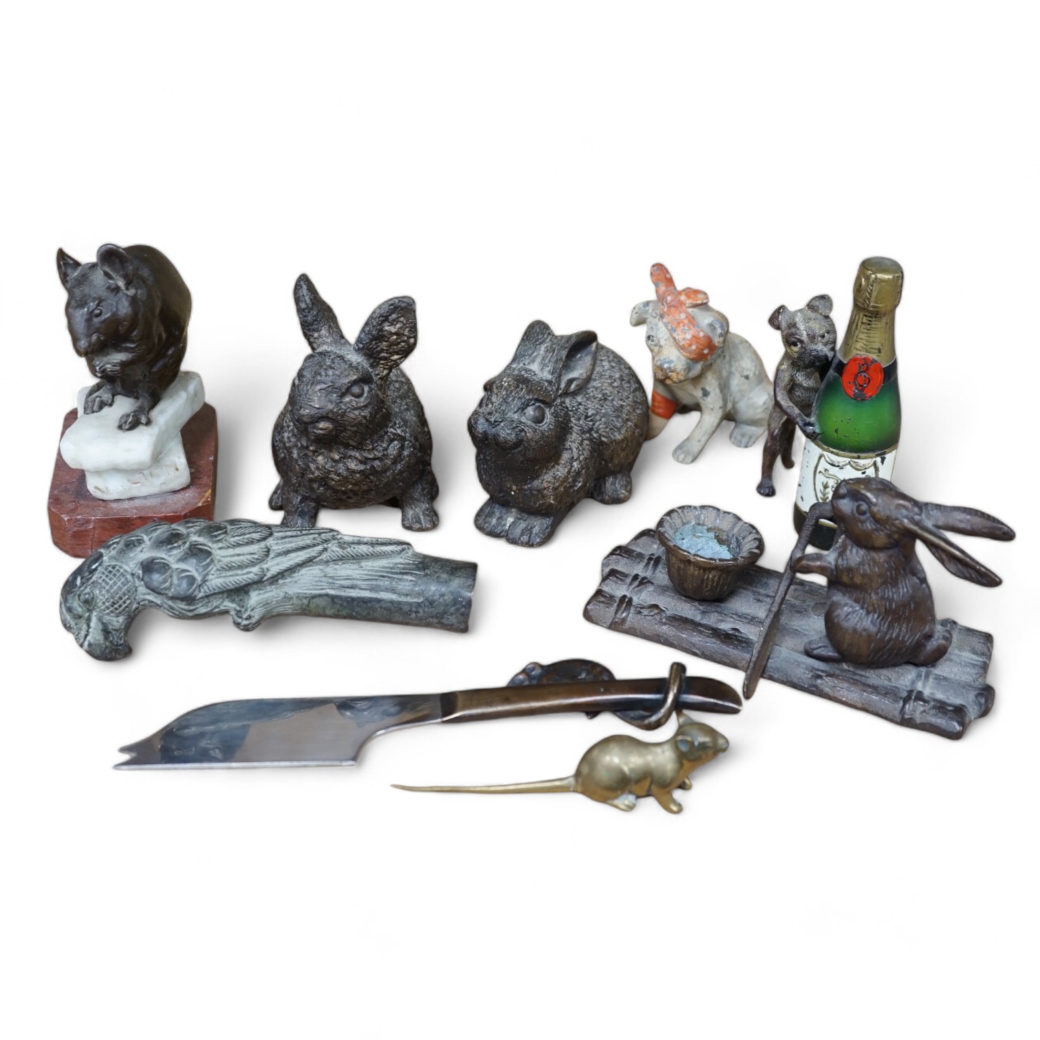 A collection of mixed metal novelty animal ornaments, walking stick handles, etc. of mice, dogs and rabbits, largest 13cm high (9). Condition - fair